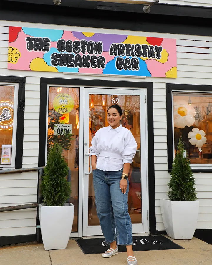 Nandita, the founder, at the studio door on Water Street
