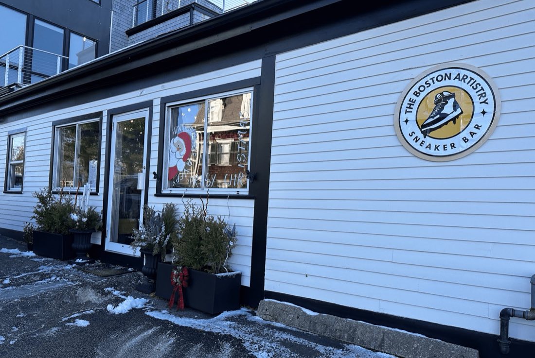 The studio's front on Water Street in winter 2023, the Sneaker Bar roundel on the white siding